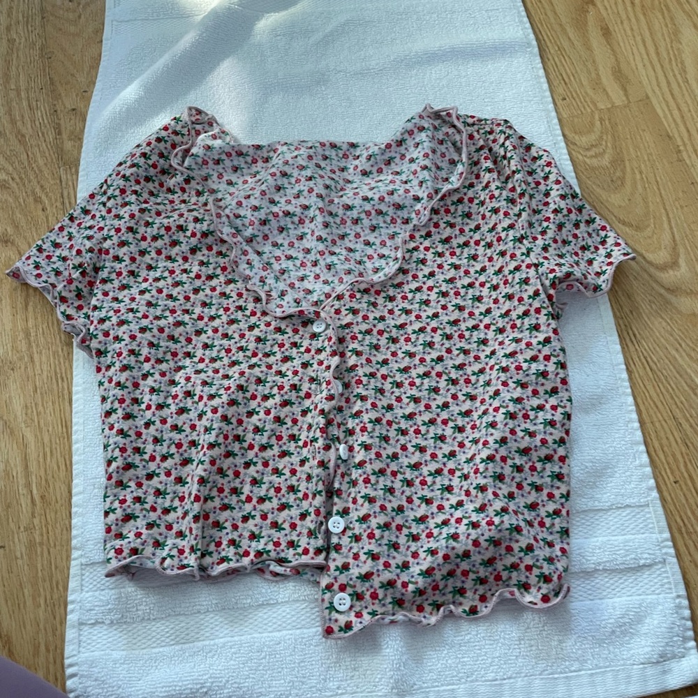 Pink blouse with red rose